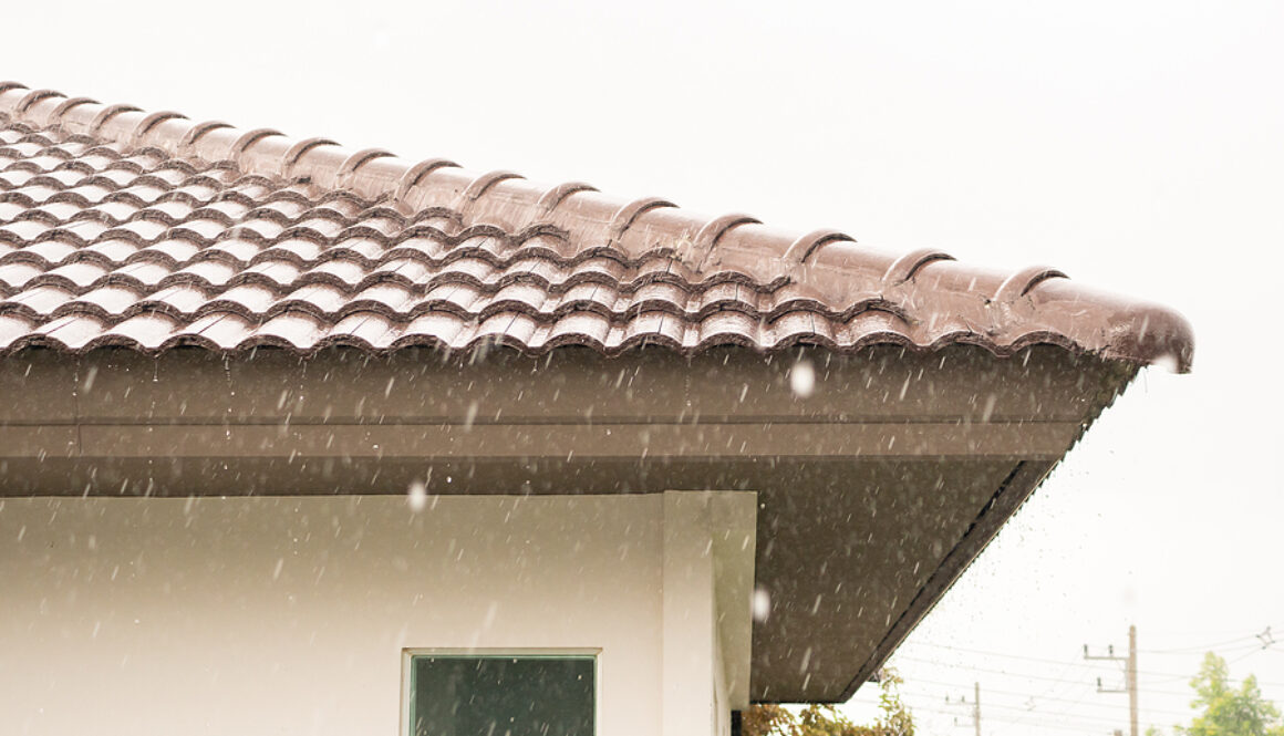 a heavy rain storm on roof of house