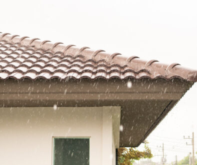 a heavy rain storm on roof of house