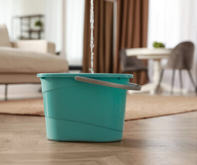 Water leaking from ceiling into a bucket